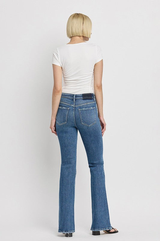 High Rise Slant Hem Flare Jeans (Online Only/Ships from USA)