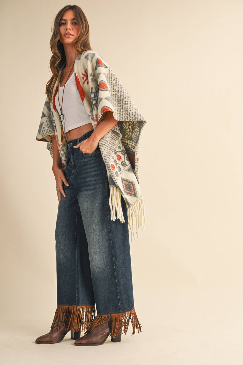 OVERSIZED FRINGED CAPE WITH PATTERNS