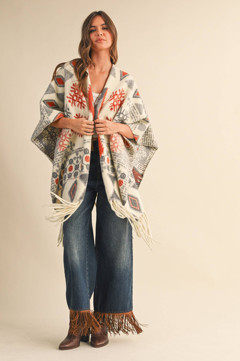 OVERSIZED FRINGED CAPE WITH PATTERNS