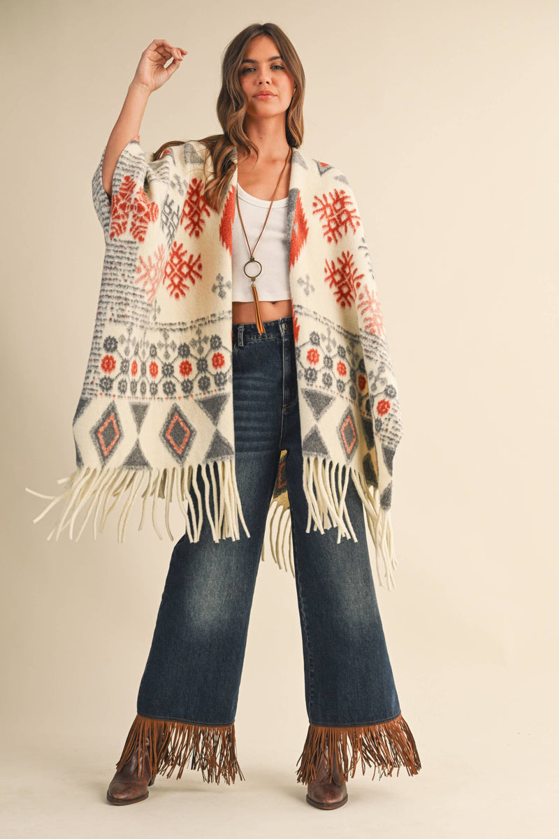 OVERSIZED FRINGED CAPE WITH PATTERNS